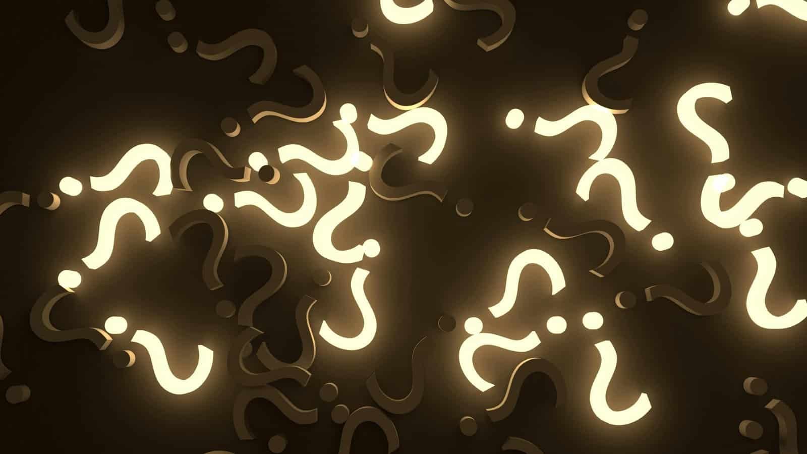 Multiple glowing question marks resembling lightbulbs in a dark setting.