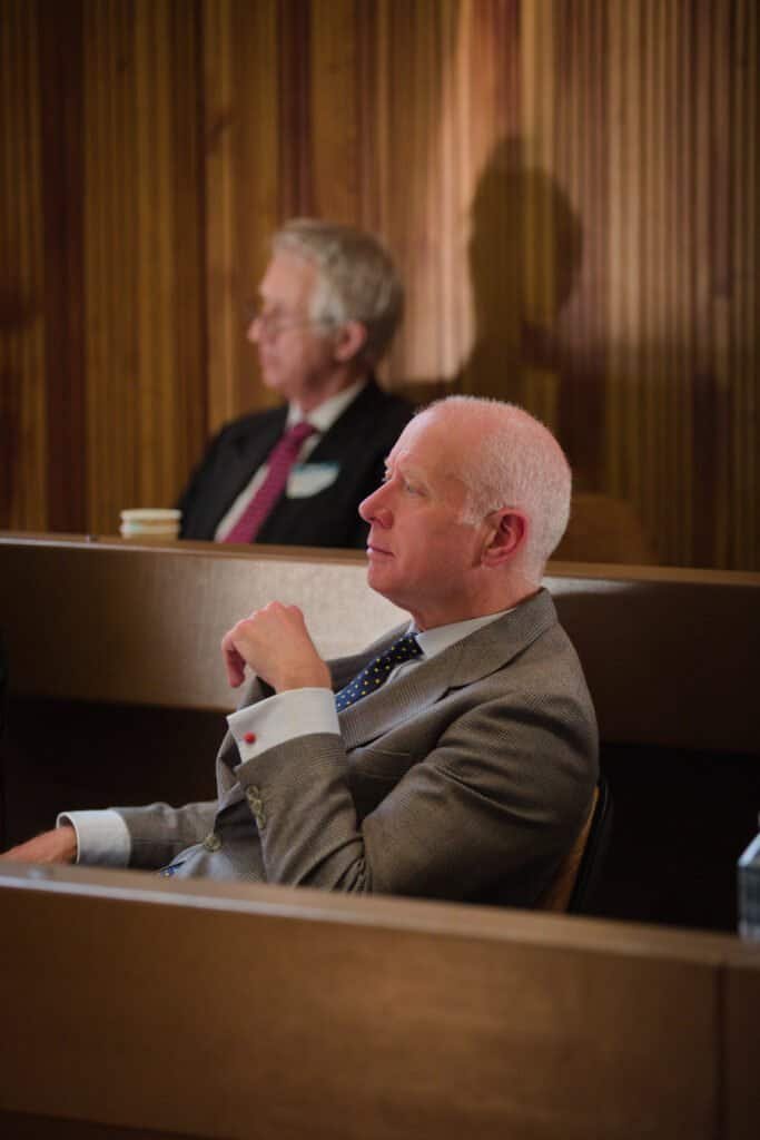 Two men in formal attire attending a professional event.